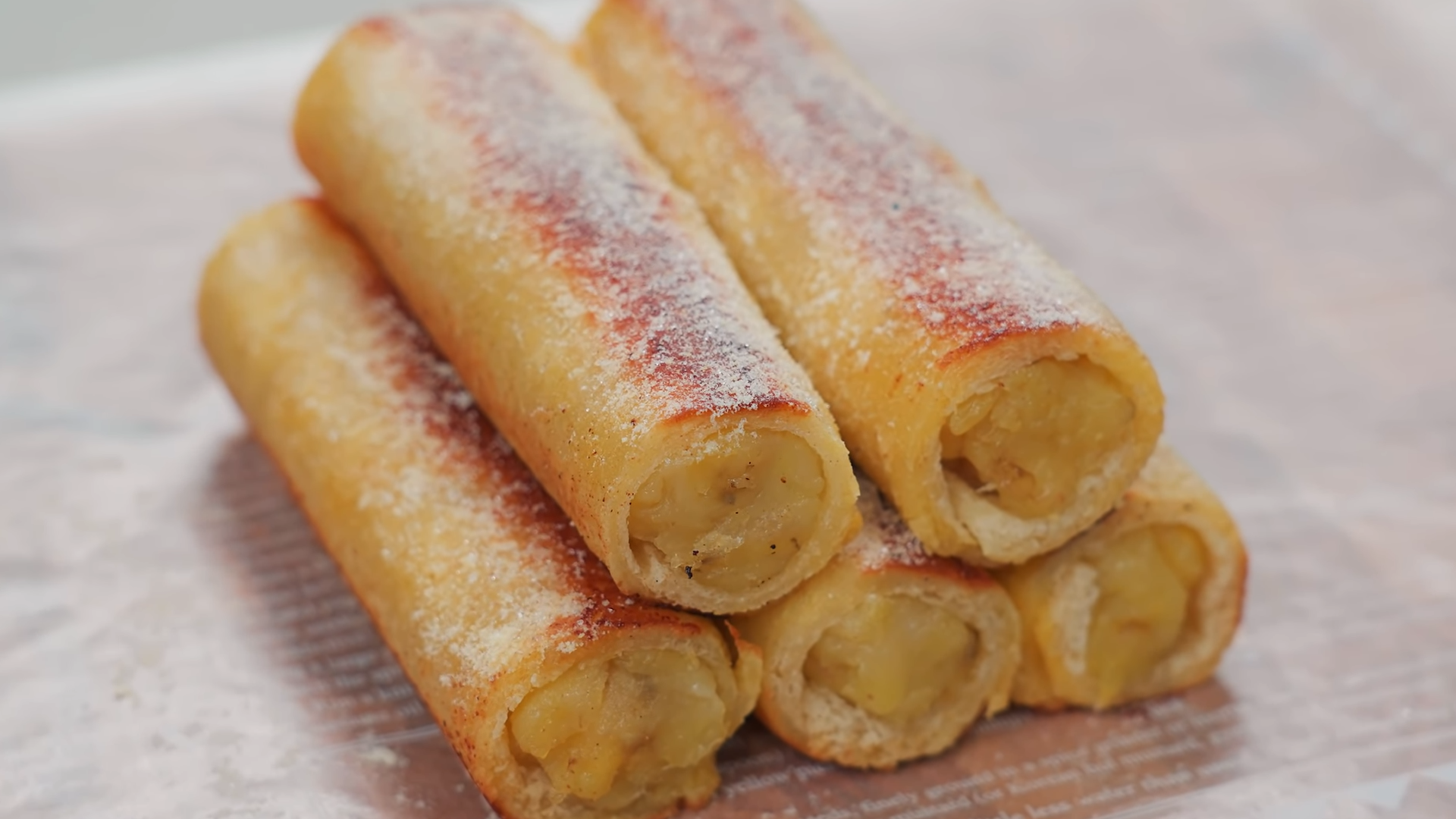 Banana roll with Nutella spread and chopped hazelnuts wrapped in a tortilla.